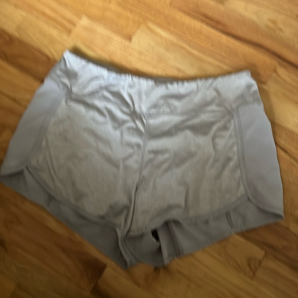 Women’s Large grey Reebok running shorts with liner and small back pocket.